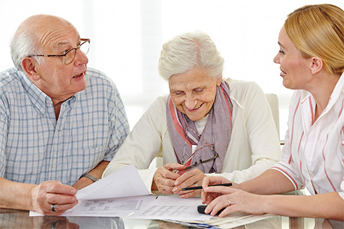 Elderly couple meeting with financial advisor